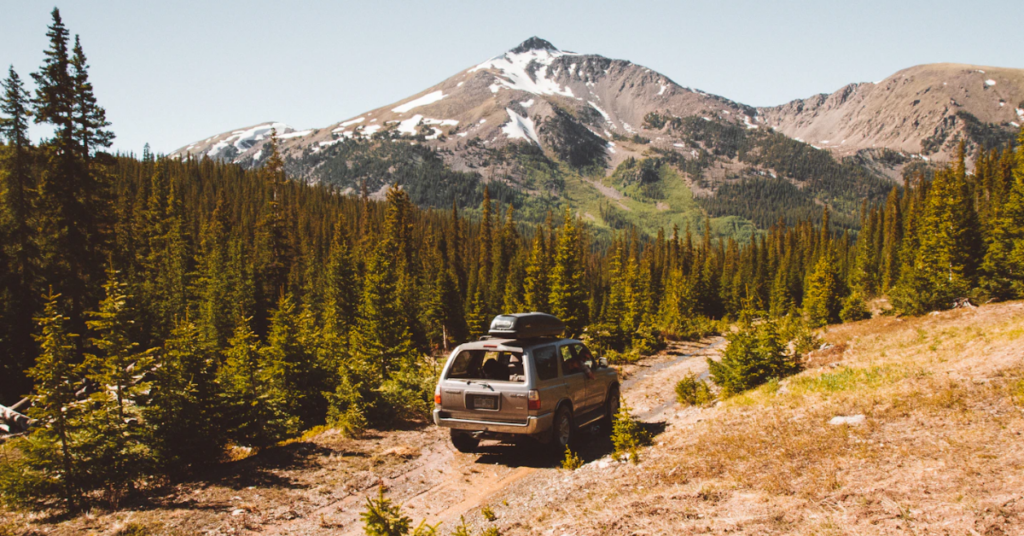 Truck driving down dirt road in Buena Vista Mountains